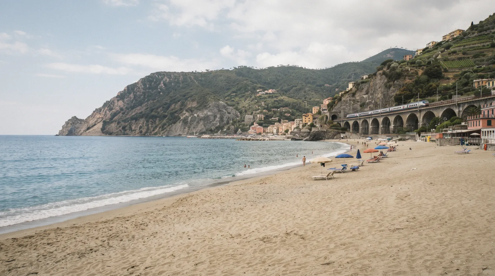 Sandy beach and blue water on the cinque terre beaches at Monterosso in Cinque Terre, Italy