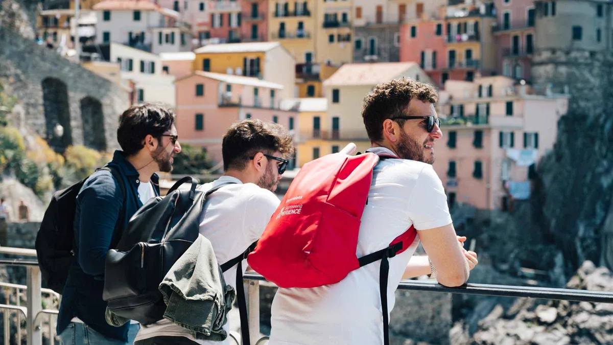 Bus tour group arriving at a Cinque Terre village on a day trip from Florence