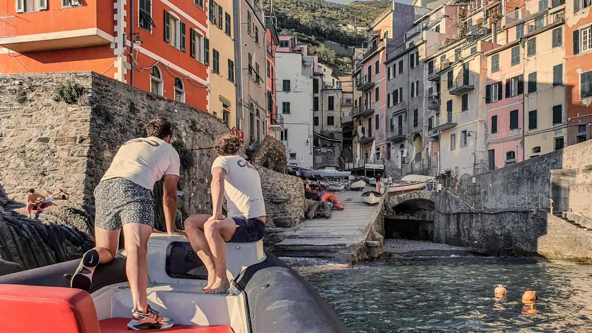 Passengers boarding a Cinque Terre boat tour with a sundeck departing from La Spezia harbor