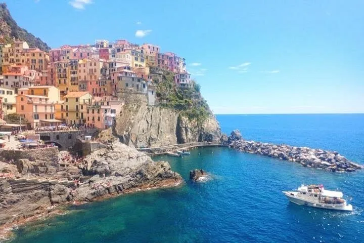 Local guide leading a small group through a Cinque Terre village on a classic day tour