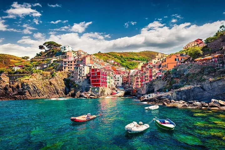 Hybrid eco-friendly boat cruising the Cinque Terre coastline near Monterosso