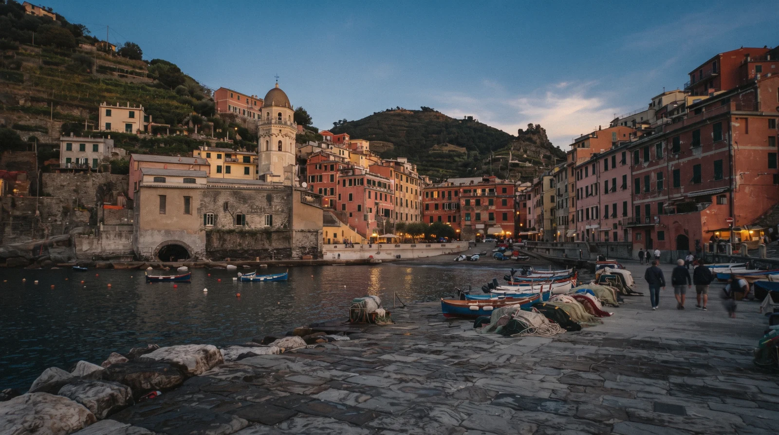 Vernazza harbour and the Doria castle tower seen from the coastal trail above the village, Cinque Terre, Italy