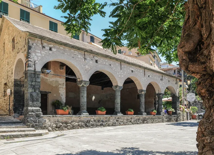 The medieval stone Loggia Comunale arcade in Levanto's old town, Italy