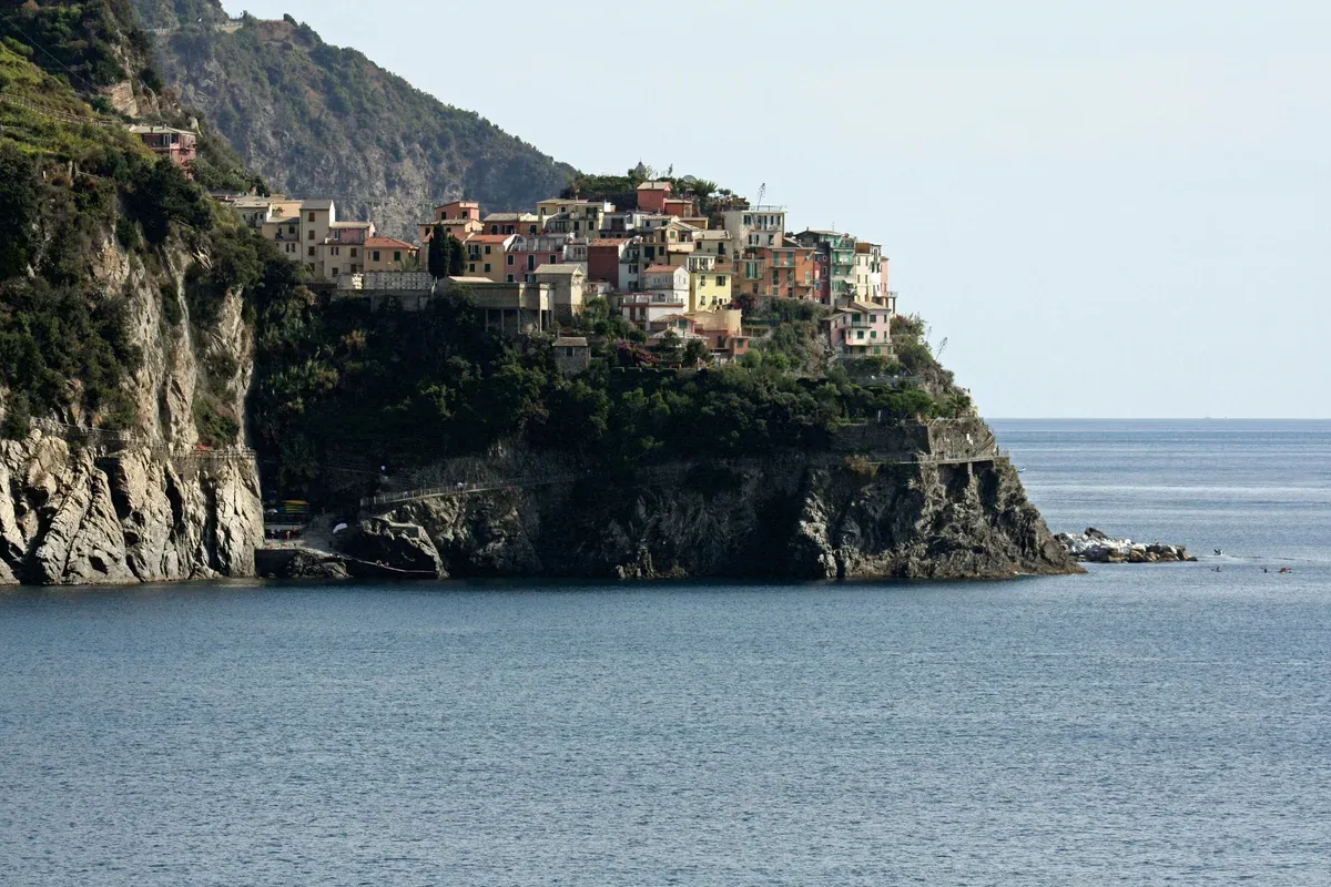 View of Manarola village on its headland from the Sentiero Azzurro trail toward Corniglia, Cinque Terre, Italy
