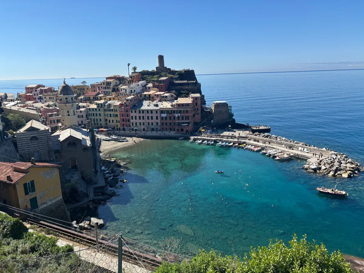 Vernazza harbour with its pastel houses and the Doria castle tower, Cinque Terre, Italy