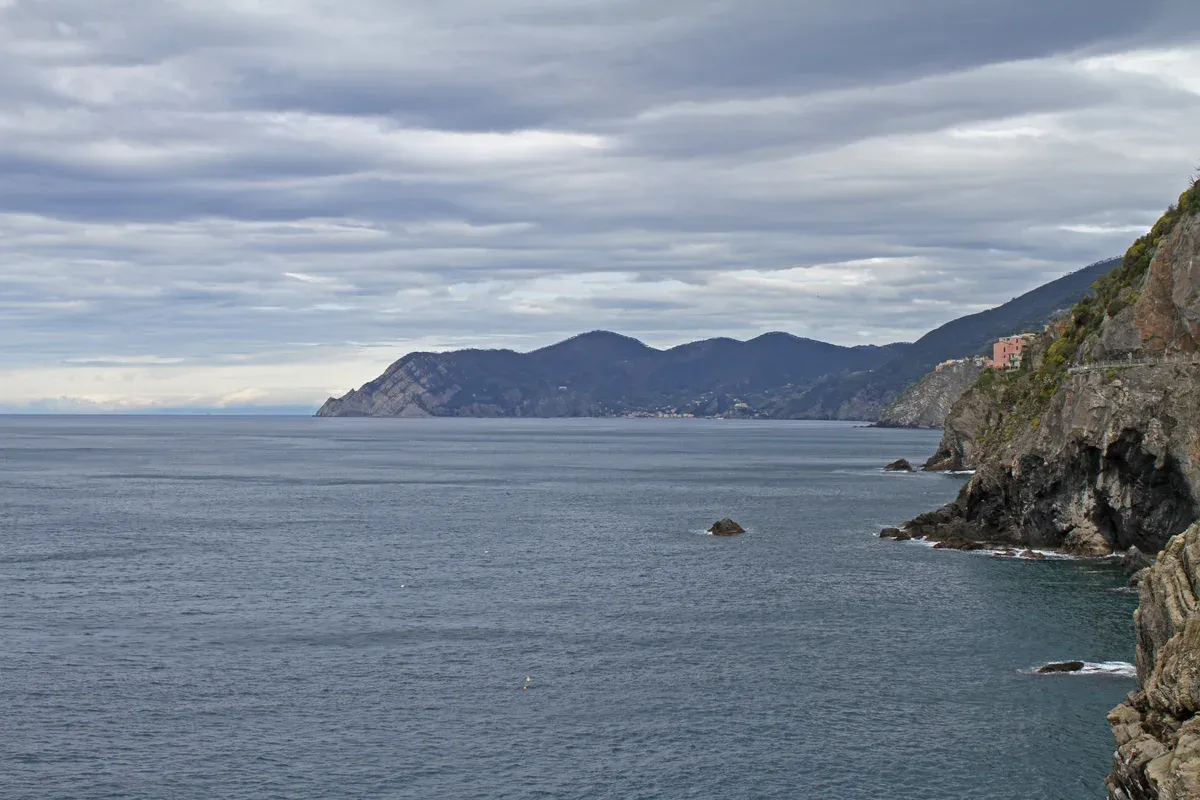 View along the cliff path of the Via dell'Amore above the sea near Riomaggiore, Cinque Terre, Italy